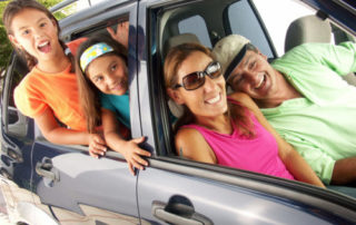 bigstock Hispanic family in a car Fam 26999903 e1539013427517