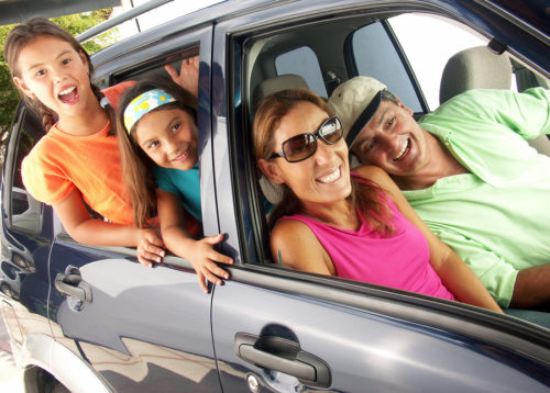 bigstock Hispanic family in a car Fam 26999903 e1539013427517