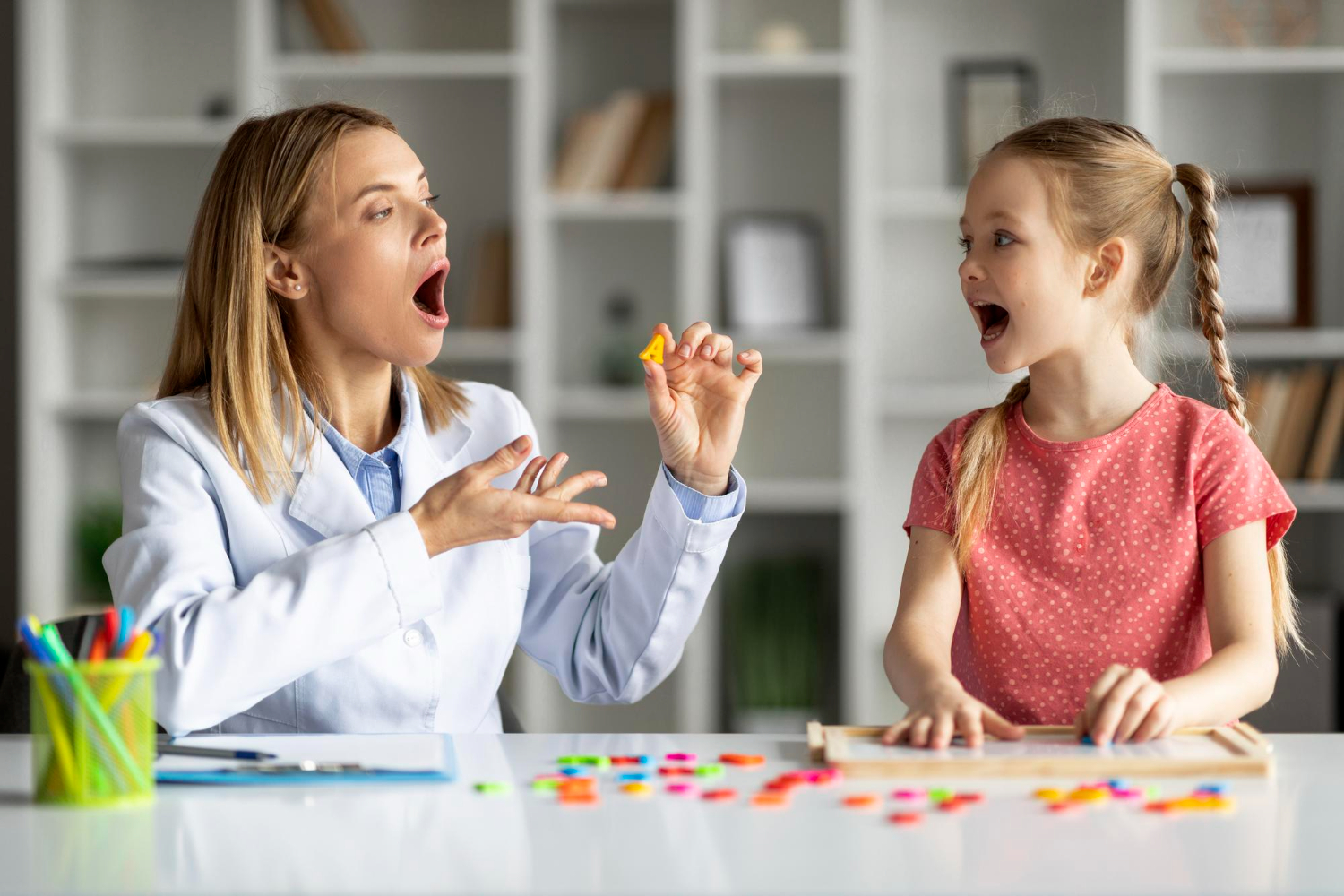 Therapist conducting speech and occupational therapy sessions for children at Theracare.